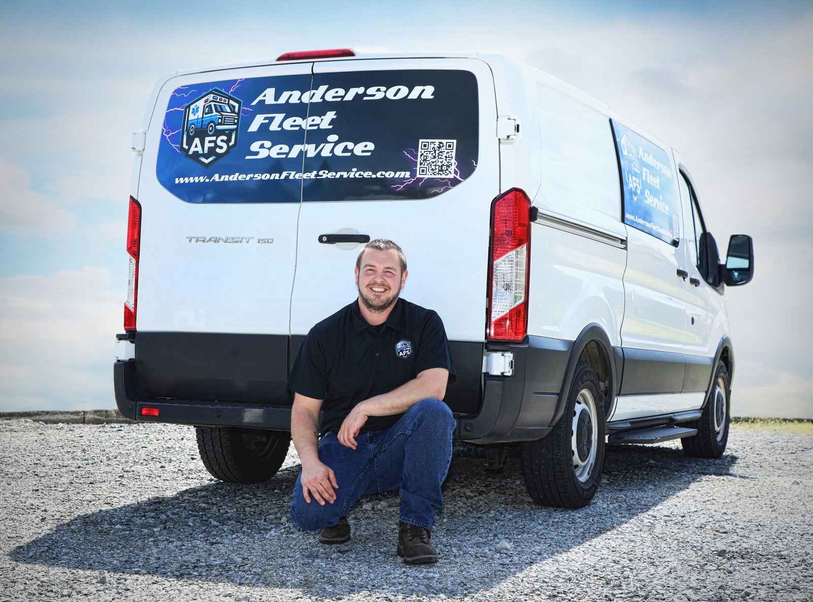 Phil Anderson, founder of Anderson Fleet Service, beside a branded AFS service van
